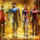 Promotional art shows Gotham Knights heroes walking through a raining street.